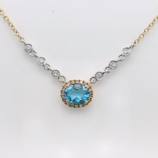 Blue Topaz surrounded with a dimond halo, 6 bezel diamonds.  MeiraT