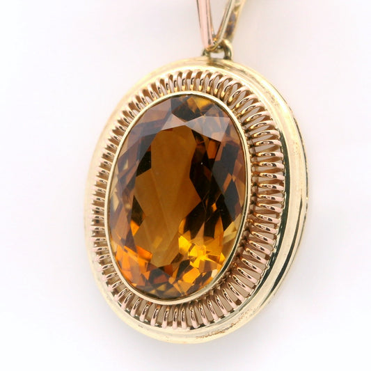 Elegant Golden Pendant with Amber Gemstone