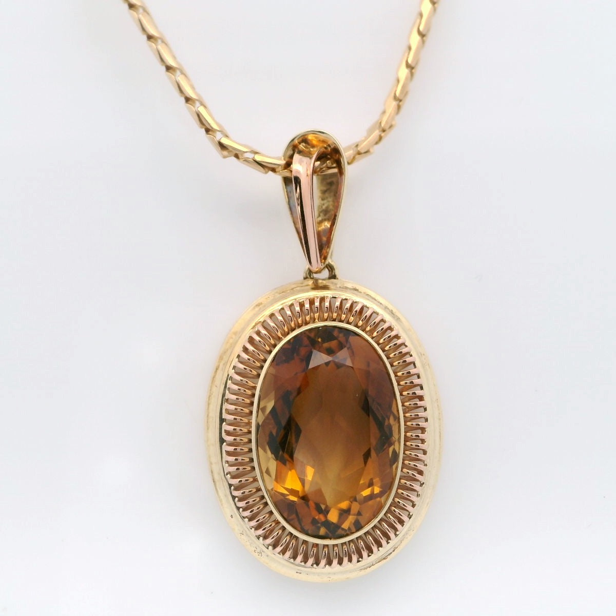 Elegant Golden Pendant with Amber Gemstone