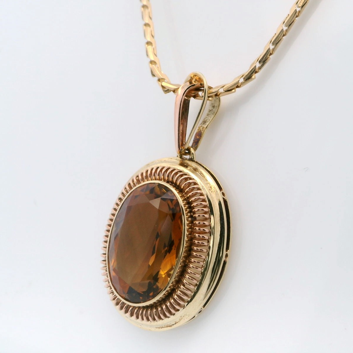 Elegant Golden Pendant with Amber Gemstone
