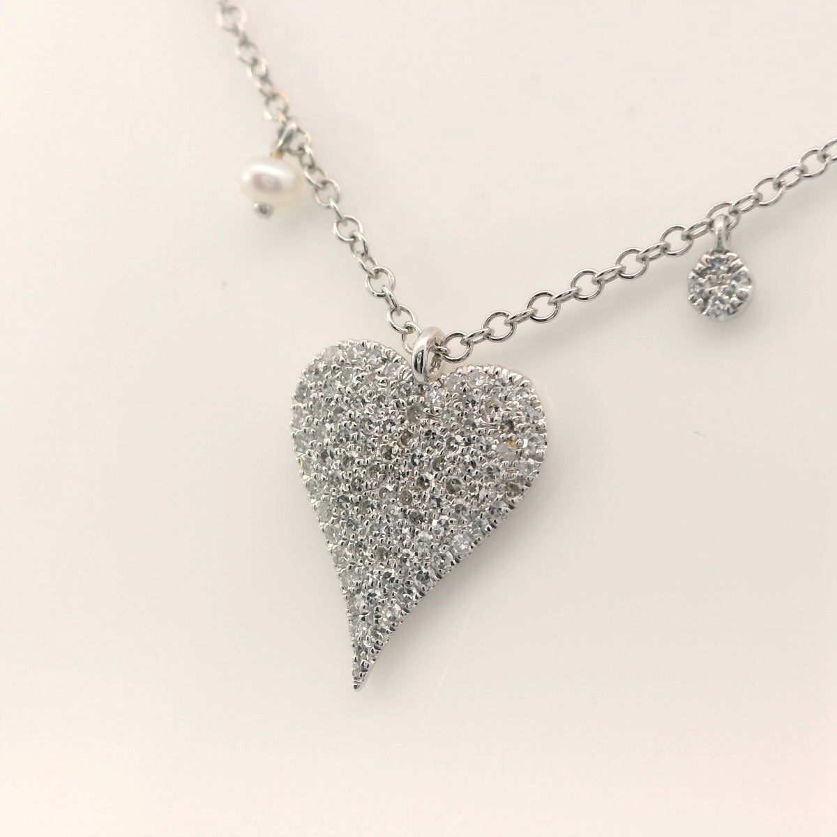 Diamond heart and charm necklace