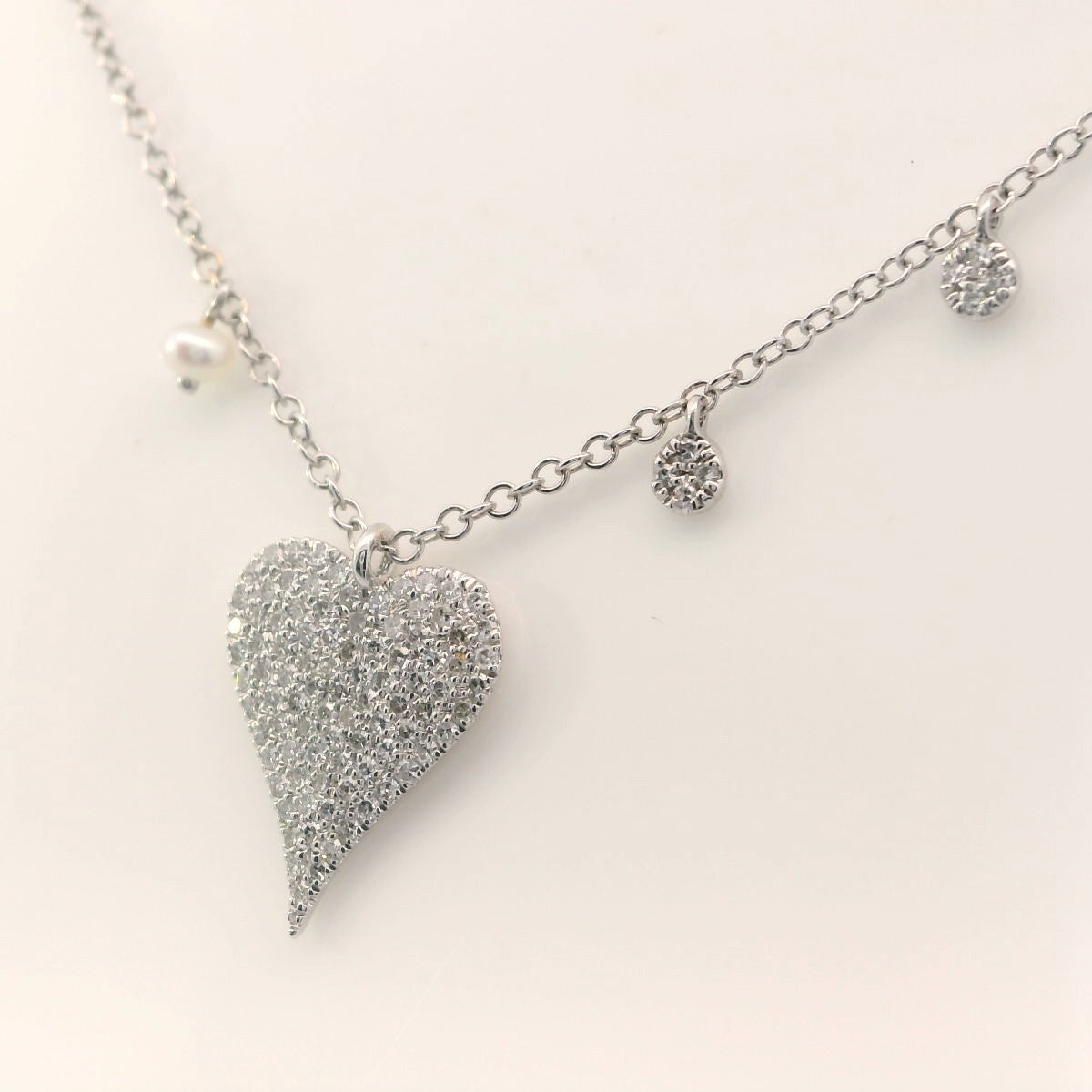 Diamond heart and charm necklace