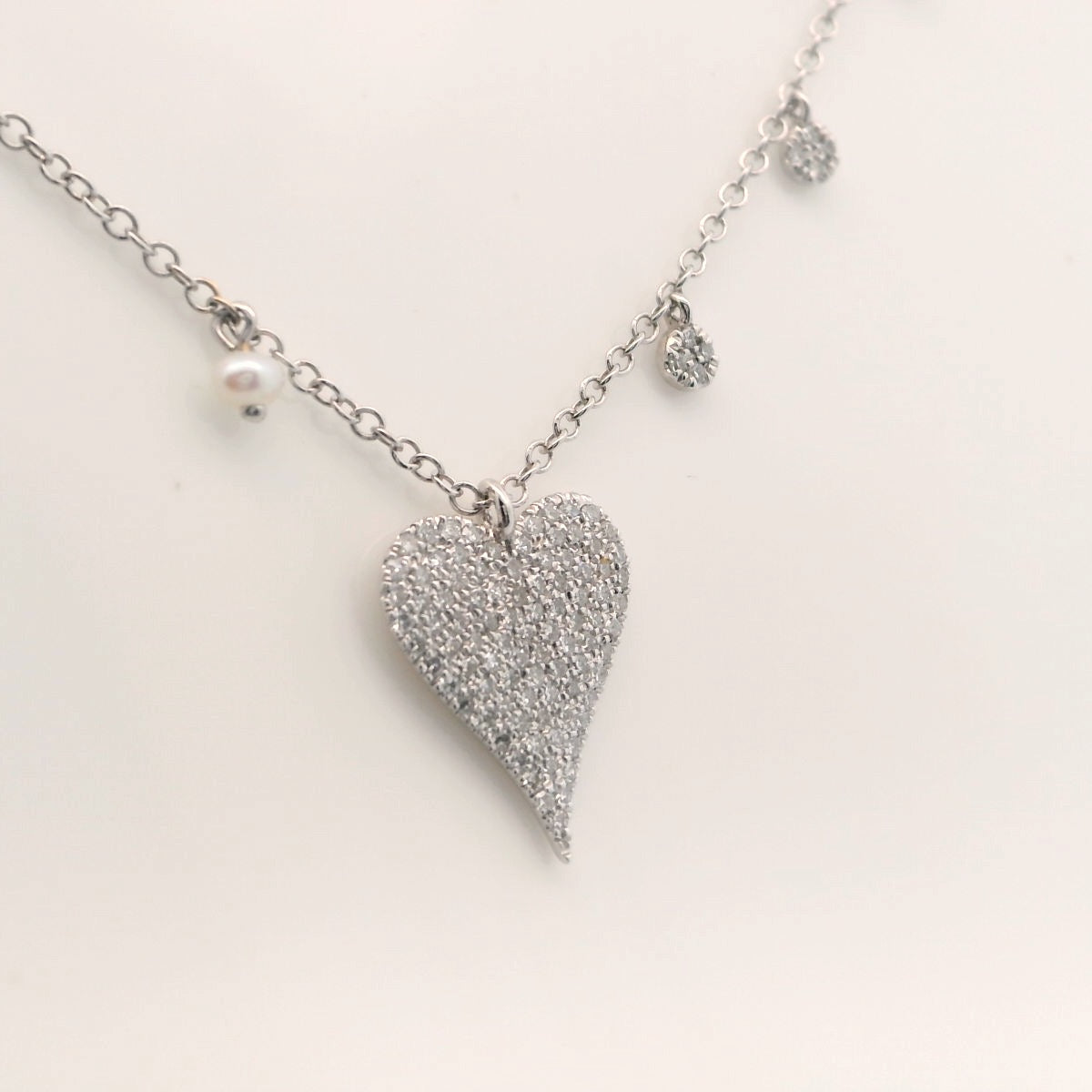 Diamond heart and charm necklace