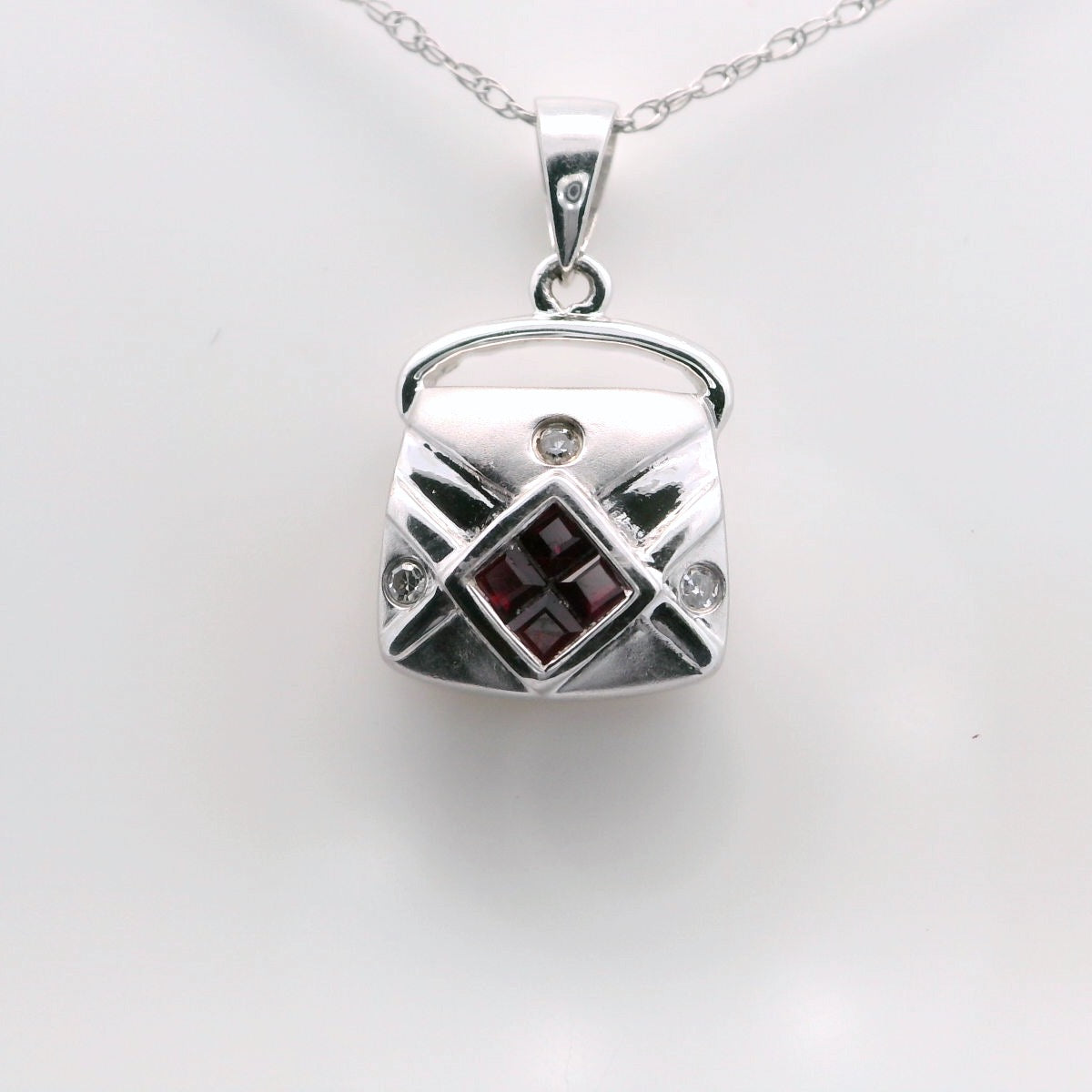 14kt white gold ruby and diamond purse. 3D